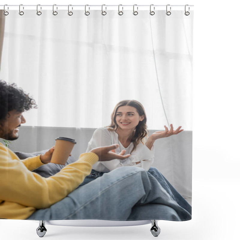 Personality  Curly Indian Man In Yellow Jumper And Denim Jeans Holding Coffee To Go While Gesturing And Talking To Positive Brunette Colleague In White Blouse On Sofa In Broadcasting Studio Shower Curtains