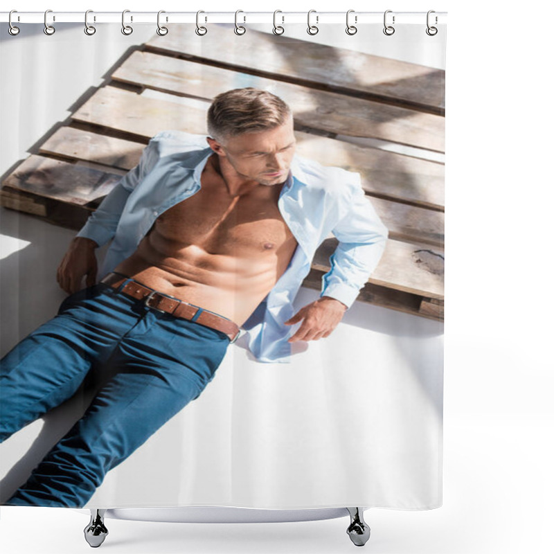 Personality  High Angle View Of Sexy Man With Unbuttoned Shirt Lying On Wooden Pallet On White And Looking Away Shower Curtains