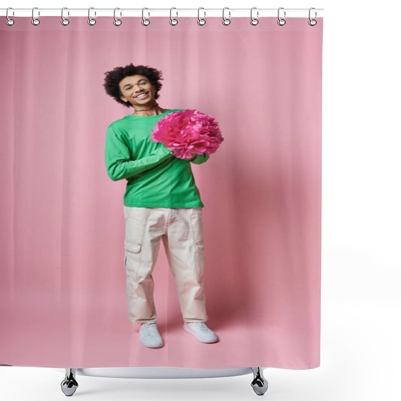 Personality  Cheerful Young African American Man In Green Shirt Holding A Delicate Pink Flower Against A Soft Pink Background. Shower Curtains