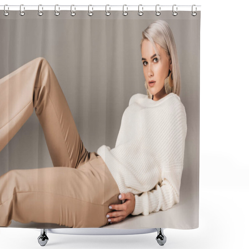 Personality  Elegant Blonde Woman Lying In White Sweater And Beige Pants, On Grey Shower Curtains