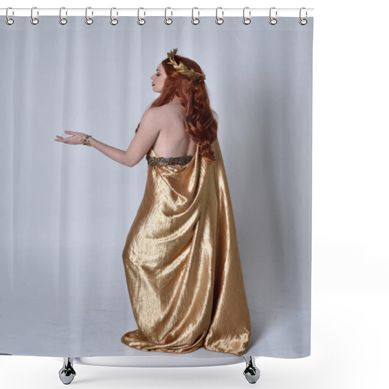 Personality  Full Length Portrait Of Girl With Red Hair Wearing Long Grecian Toga And Golden Wreath. Standing Pose With Back To The Camera,  Isolated Against A Grey Studio Background. Shower Curtains