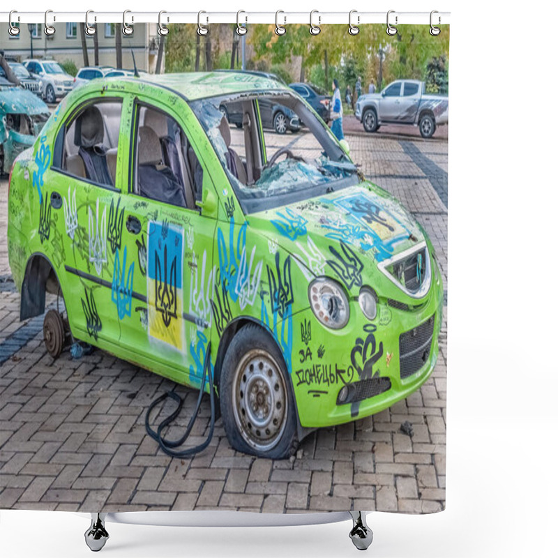 Personality  Kyiv, Ukraine - October 27, 2023: Brightly Painted, Damaged Car Covered In Ukrainian Symbols And Graffiti At The Destroyed Russian Military Equipment Exhibition In Mykhailivska Square, Kyiv. This Car Symbolizes Ukrainian Resistance And Patriotism Shower Curtains