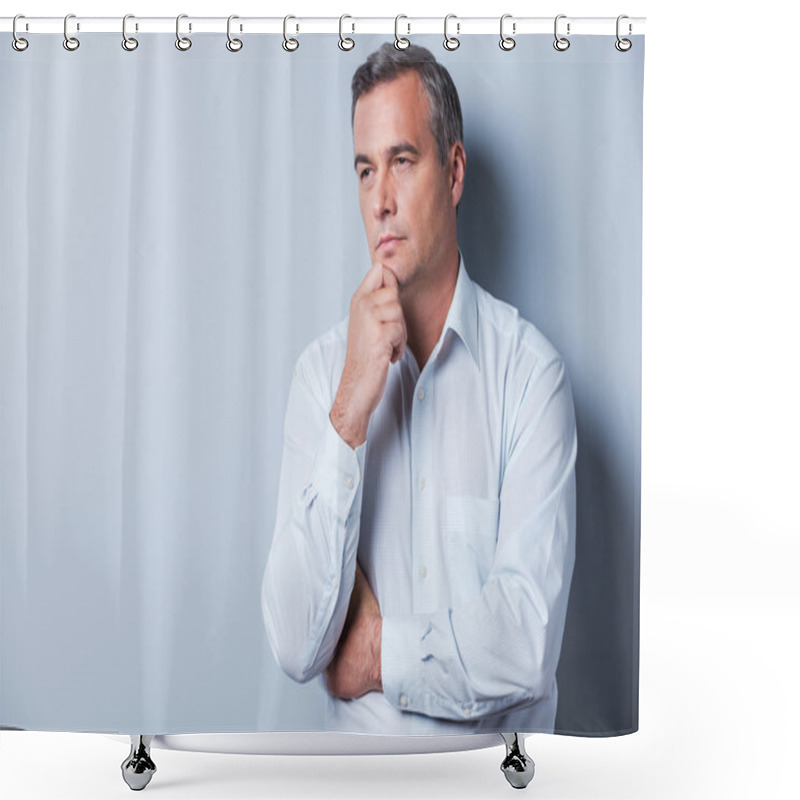 Personality  Lost In Thoughts. Portrait Of Thoughtful Mature Man In Shirt Holding Hand On Chin And Looking Away While Standing Against Grey Background Shower Curtains