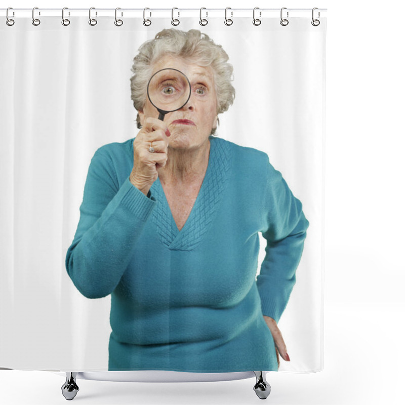 Personality  Portrait Of Senior Woman Looking Through A Magnifying Glass Over Shower Curtains