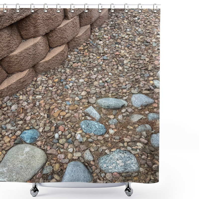 Personality  A Close-up View Of An Aging Retaining Wall Made Of Stacked Concrete Blocks, Surrounded By A Bed Of Decorative Stones In Various Colors And Sizes. The Landscape Shows Signs Of Wear And Is Ready For Shower Curtains