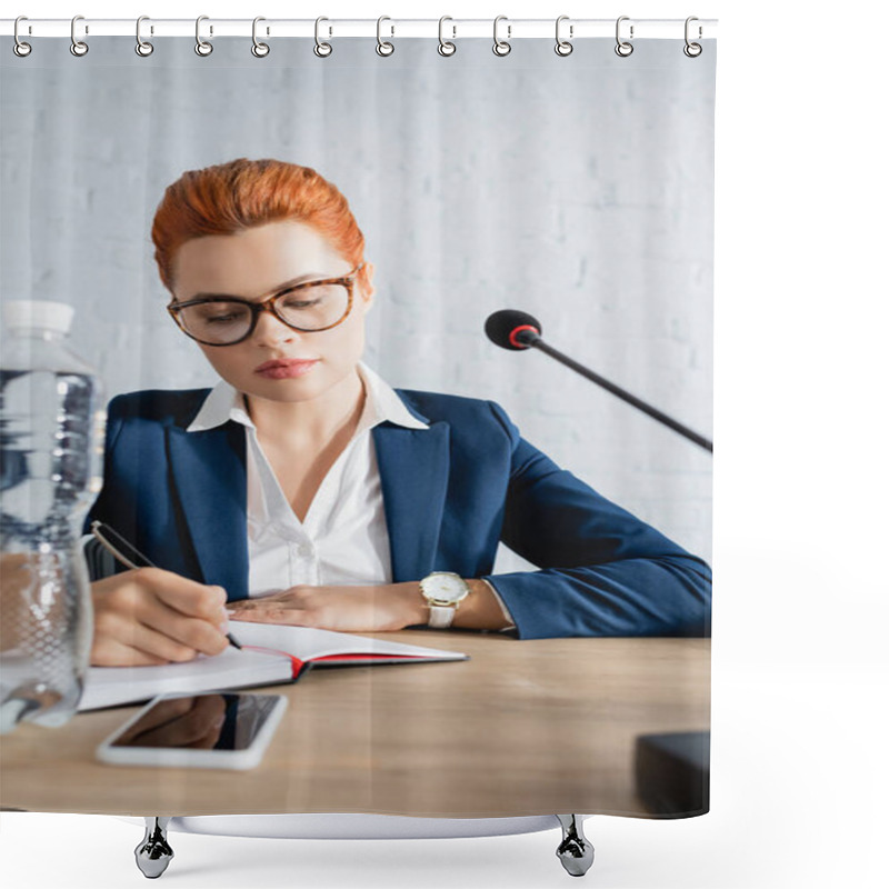 Personality  Redhead Woman In Formal Wear, Writing In Notebook, While Sitting At Table With Bottle Of Water And Microphone Shower Curtains