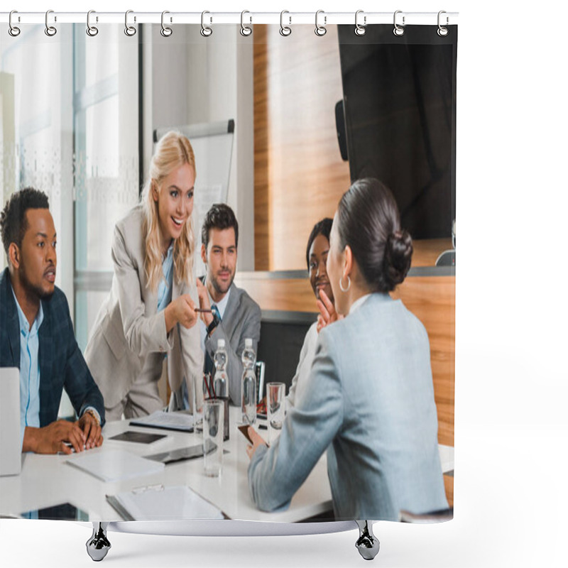 Personality  Young Smiling Businesswoman Pointing With Pencil Near Multicultural Colleagues Sitting At Desk In Conference Hall Shower Curtains