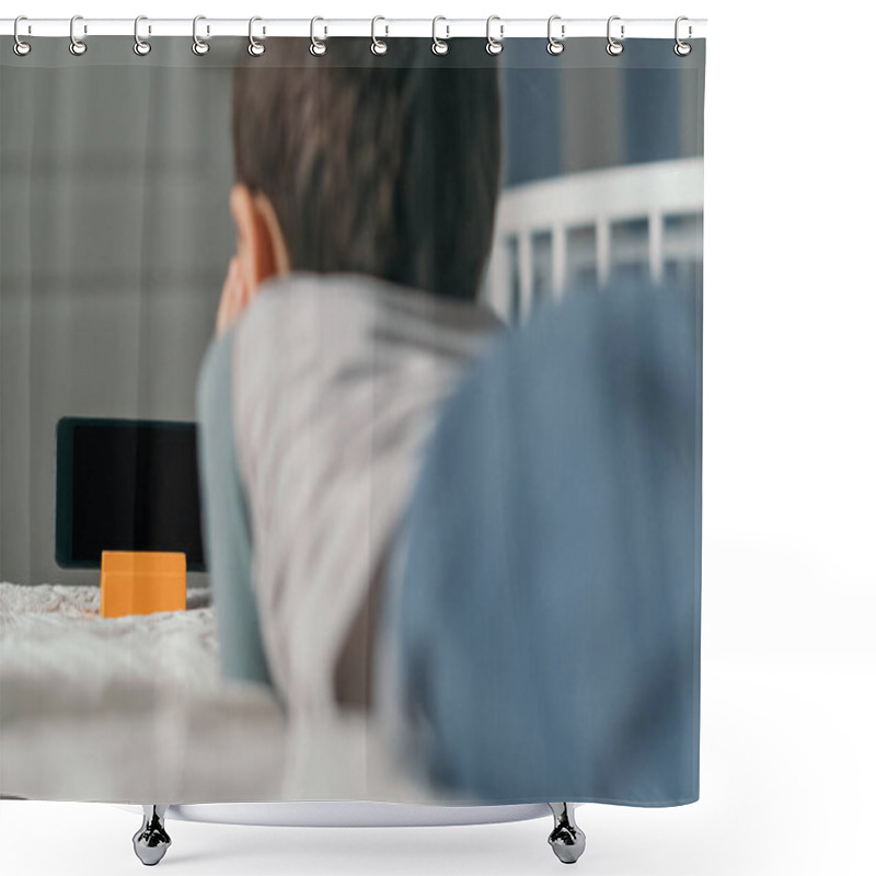 Personality  Back View Of Boy Looking At Smartphone With Blank Screen While Lying On Bed Shower Curtains