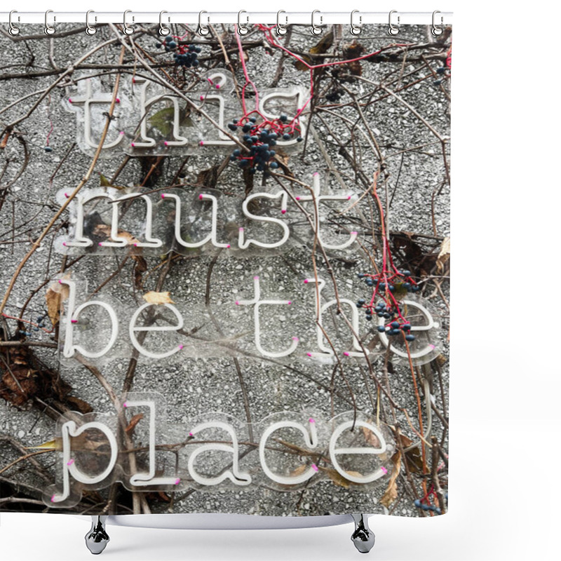 Personality  Close-up Of A Neon Text Sign Reading 'this Must Be The Place,' Surrounded By Vines And Berries, Set Against A Textured Wall. The Scene Evokes Concepts Of Nature Meeting Urban Art. Shower Curtains