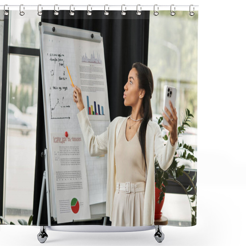 Personality  A Young Woman Energetically Explains Data Trends While Holding Her Smartphone In An Office. Shower Curtains