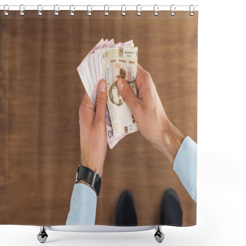 Personality  Top View Of Man Holding Hryvnias Banknotes On Wooden Background Shower Curtains