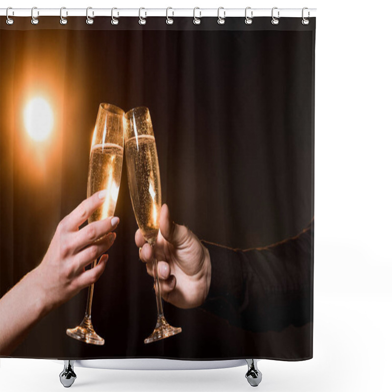 Personality  Cropped Shot Of Couple Clinking Glasses Of Champagne Under Golden Light Shower Curtains