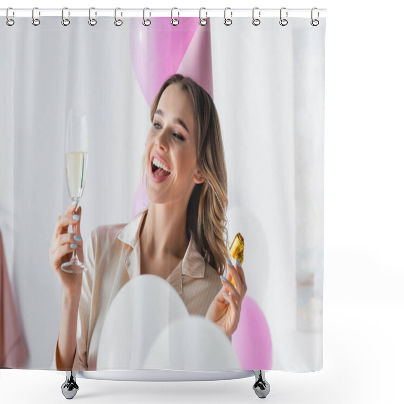 Personality  Smiling Woman In Party Cap Holding Horn And Champagne Near Balloons At Home  Shower Curtains