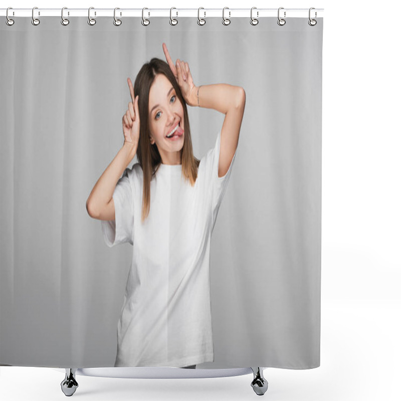 Personality  Cheerful And Tricky Woman Sticking Out Tongue And Showing Horns Gesture Isolated On Grey Shower Curtains