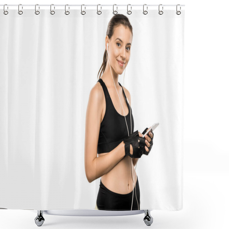 Personality  Attractive Sportswoman In Weightlifting Gloves And Earphones Using Smartphone Isolated On White Shower Curtains