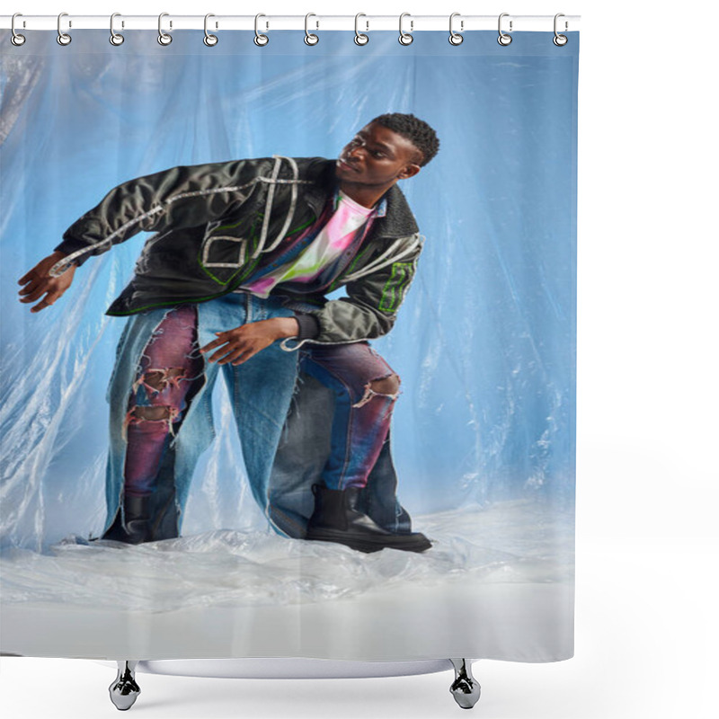 Personality  Stylish Young Afroamerican Model In Outwear Jacket With Led Stripes And Ripped Jeans Looking Away And Posing On Glossy Cellophane On Blue Background, Urban Outfit And Sustainable Lifestyle  Shower Curtains