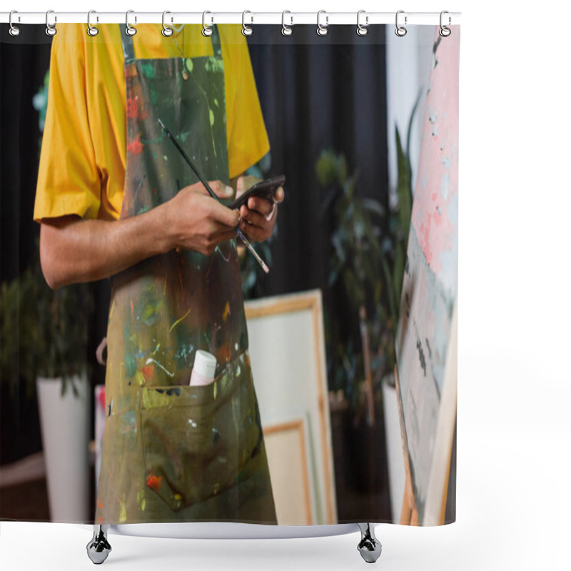 Personality  Cropped View Of African American Artist Holding Paintbrush And Using Smartphone In Studio  Shower Curtains