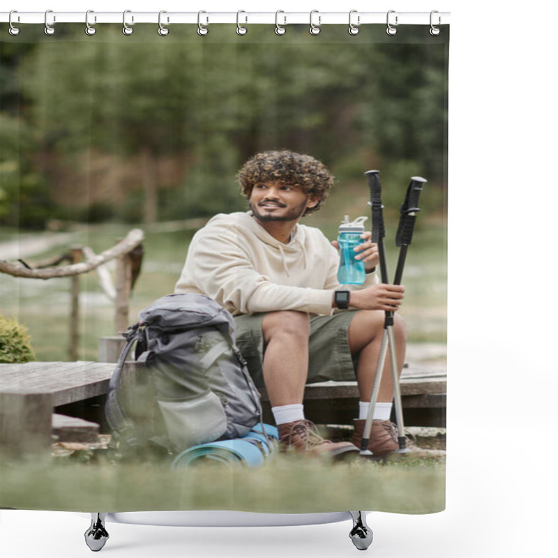 Personality  Smiling Indian Traveler Holding Trekking Poles And Sports Bottle Near Backpack In Forest Shower Curtains