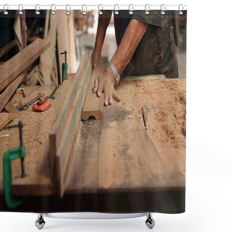 Personality  Piece Of Wooden Board Is Being Shaved On A Router Table By Hands Of Senior Carpenter In Carpentry Workshop.Selective Focus And Shallow Depth Of Field. Shower Curtains