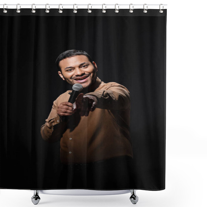 Personality  Happy Indian Comedian In Shirt And Bow Tie Holding Microphone And Pointing With Finger During Monologue On Black  Shower Curtains