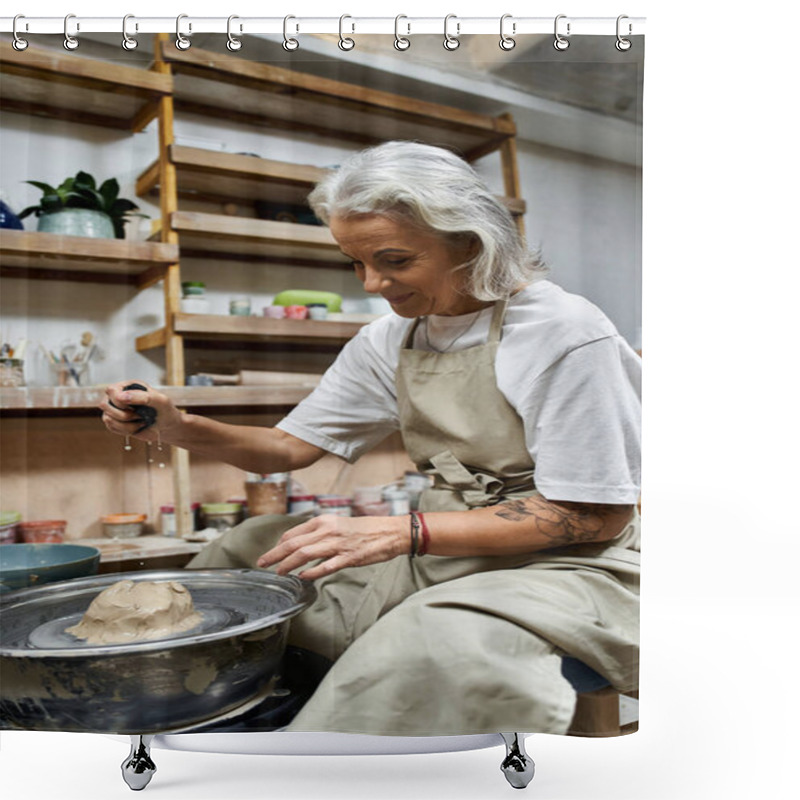 Personality  This Mature Woman Skillfully Shapes Clay On A Pottery Wheel In Her Inviting Workspace. Shower Curtains