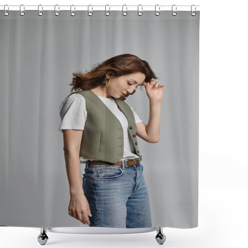 Personality  Woman In Green Vest, White Shirt, And Blue Jeans With Long Brown Hair Poses Against Grey Background, Looking Down, Touching Her Hair Shower Curtains