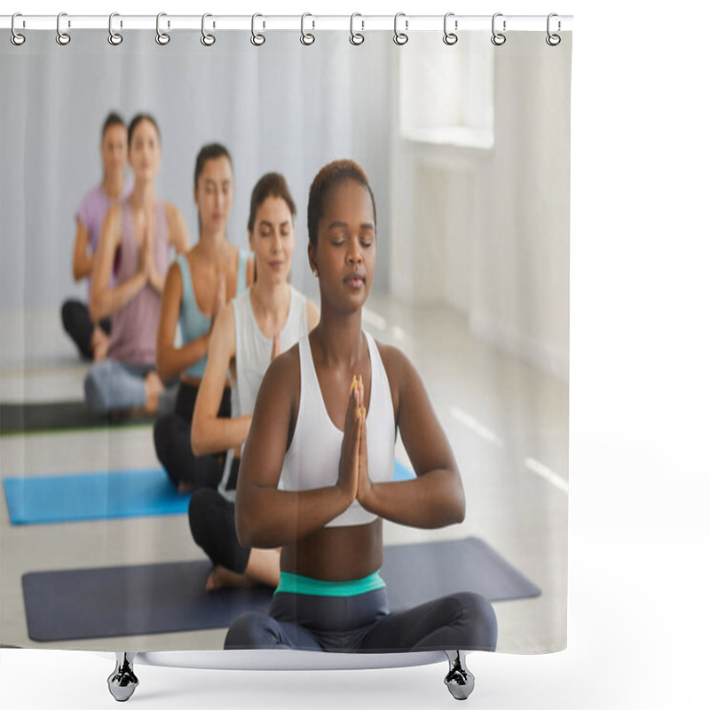 Personality  Portrait Of A Relaxed Athletic Dark-skinned Woman Sitting In A Lotus Position And Meditating In A Group Yoga Class. Woman Sitting With Closed Eyes On The Background Of Other Meditating Women. Shower Curtains