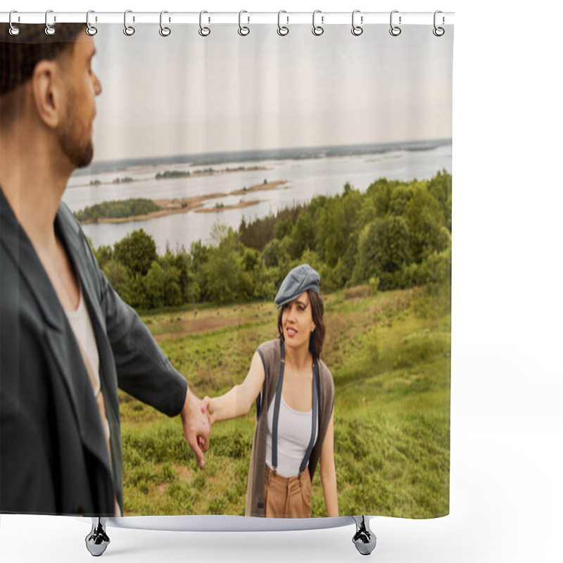 Personality  Smiling And Trendy Brunette Woman In Suspenders And Newsboy Cap Holding Hand Of Blurred Boyfriend In Jacket While Standing With Nature And Sky At Background, Fashionable Couple In Countryside Shower Curtains