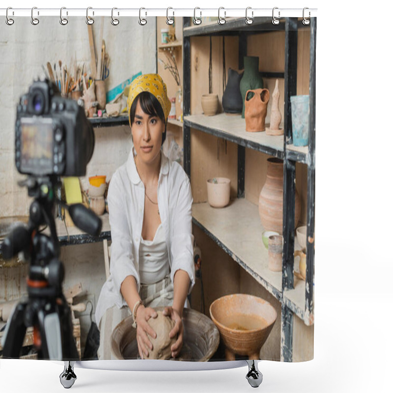 Personality  Young Brunette Asian Craftswoman In Headscarf And Workwear Molding Clay On Pottery Wheel Near Blurred Digital Camera On Tripod And Rack With Sculptures In Studio, Pottery Artist Showcasing Craft Shower Curtains