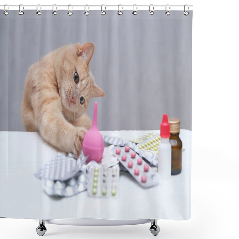 Personality  A Red-haired Cat Sitting In Front Of A Pile Of Medicines And Playing With A Rubber Medical Enema. Pet Treatment Concept. Shower Curtains