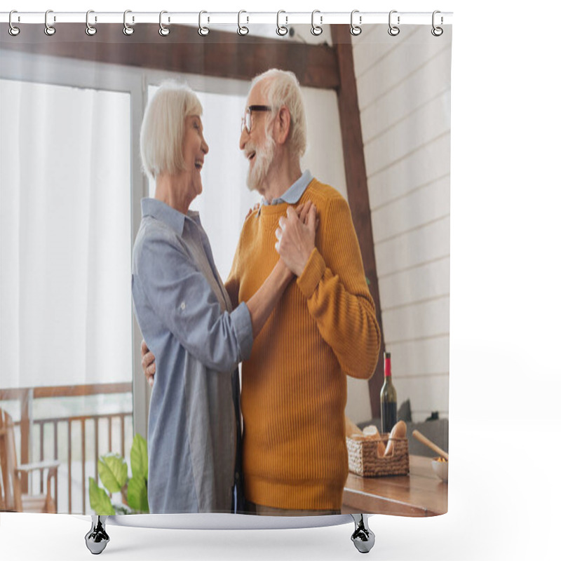 Personality  Happy Elderly Couple Laughing While Dancing At Home On Blurred Background Shower Curtains