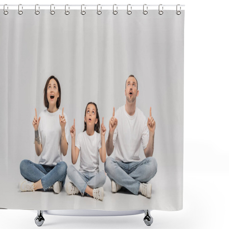 Personality  Amazed Family Sitting With Crossed Legs In White T-shirts And Blue Denim Jeans While Pointing With Fingers And Looking Up On Grey Background, Father, Tattooed Mother And Preteen Daughter  Shower Curtains