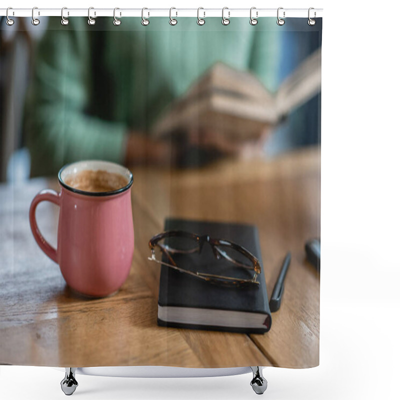 Personality  Mug With Coffee Near Eyeglasses, Notebook And African American Woman On Blurred Background  Shower Curtains