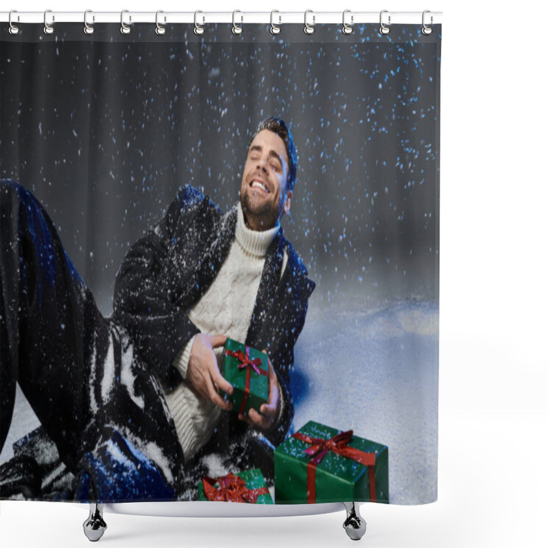 Personality  Cheerful Young Man Sits On Snow Covered Ground Surrounded By Presents While Enjoying The Moment. Shower Curtains