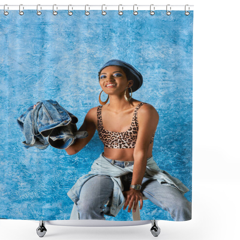 Personality  Positive African American Woman In Beret, Jeans And Golden Earrings Holding Denim Jacket While Sitting On Chair On Blue Textured Background, Stylish Denim Attire Shower Curtains