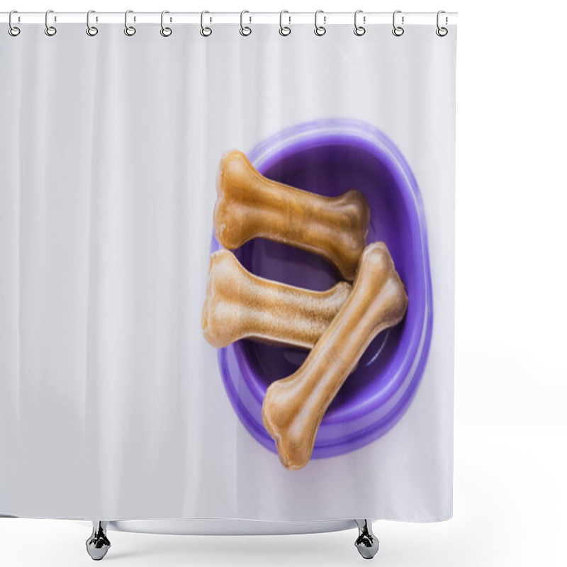 Personality  Top View Of Bone Shaped Pet Treats In Purple Bowl Isolated On White Shower Curtains