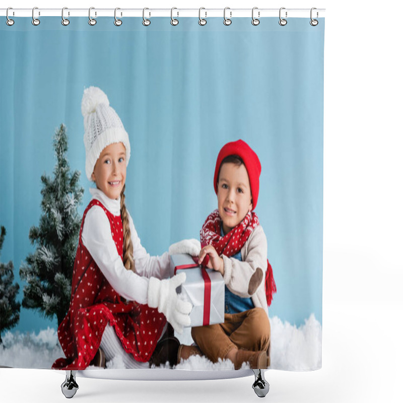 Personality  Kids In Winter Outfit Sitting On Snow And Touching Present Isolated On Blue Shower Curtains