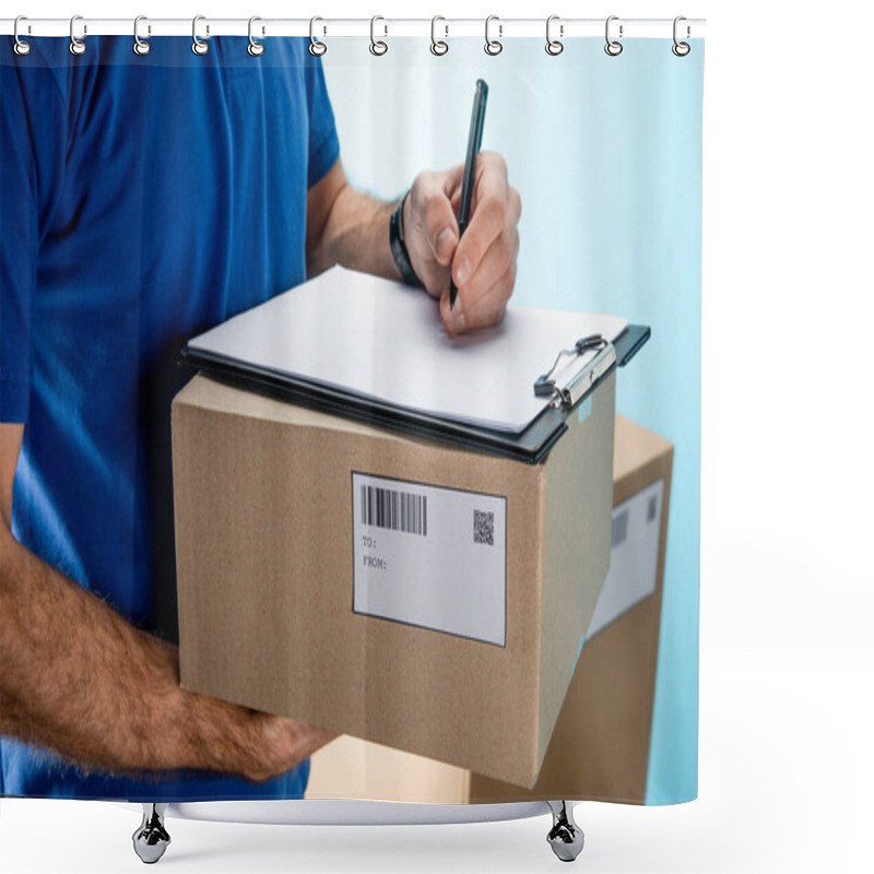 Personality  Cropped View Of Courier Writing On Clipboard On Cardboard Box With Packages Isolated On Blue Shower Curtains