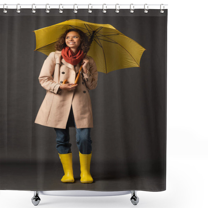 Personality  Smiling Woman In Trench Coat And Rubber Boots Holding Yellow Umbrella And Looking Away On Black Background Shower Curtains