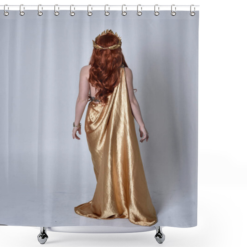 Personality  Full Length Portrait Of Girl With Red Hair Wearing Long Grecian Toga And Golden Wreath. Standing Pose With Back To The Camera,  Isolated Against A Grey Studio Background. Shower Curtains