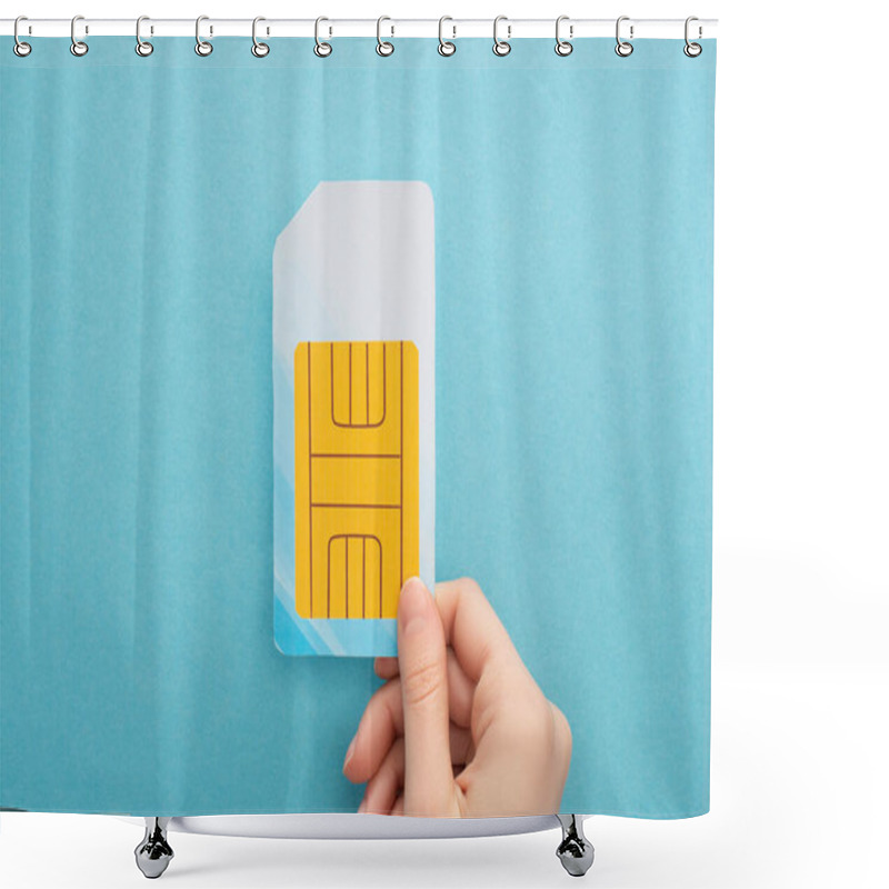 Personality  Cropped View Of Woman Holding Sim Card On Blue Background Shower Curtains