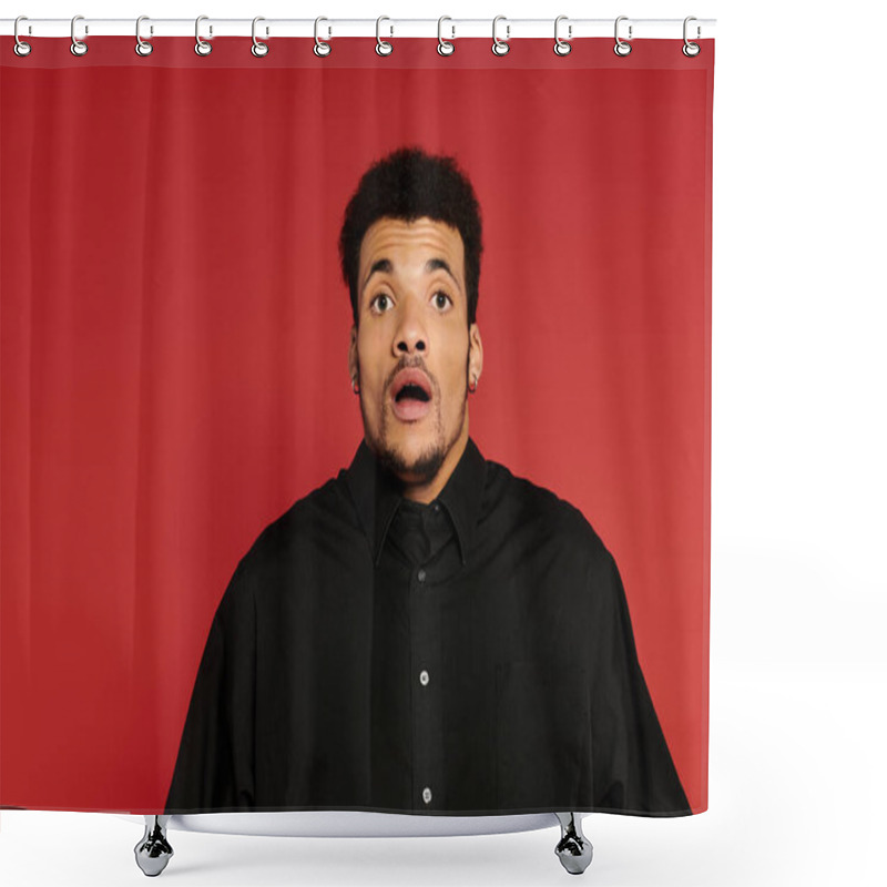 Personality  A Young Man With A Surprised Expression Stands Indoors Against A Bold Red Background. Shower Curtains