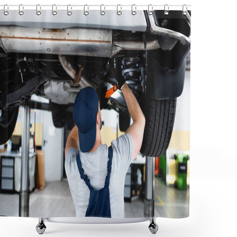 Personality  Back View Of Mechanic In Cap Holding Flashlight And Repairing Car In Service Station  Shower Curtains