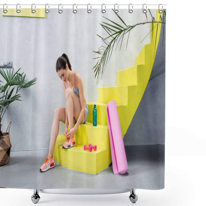 Personality  Selective Focus Of Young Sportswoman Tying Sneaker Lace Near Bottle Of Water And Sport Equipment On Stairs At Home   Shower Curtains