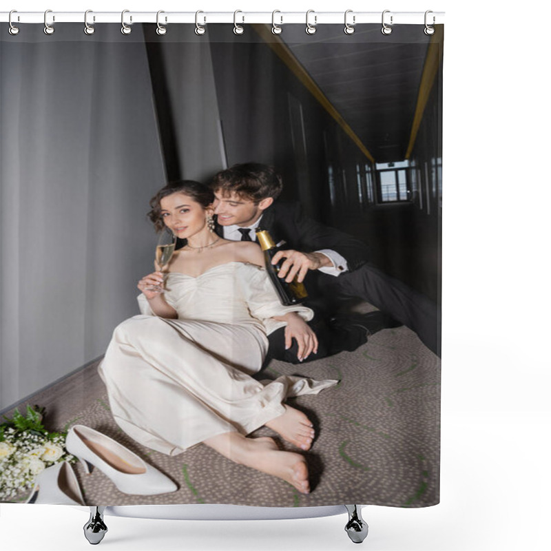 Personality  Happy Groom In Black Suit Holding Bottle And Looking At Gorgeous Bride Drinking Champagne Next To Bridal Bouquet And High Heels On Floor In Hall Of Modern Hotel  Shower Curtains