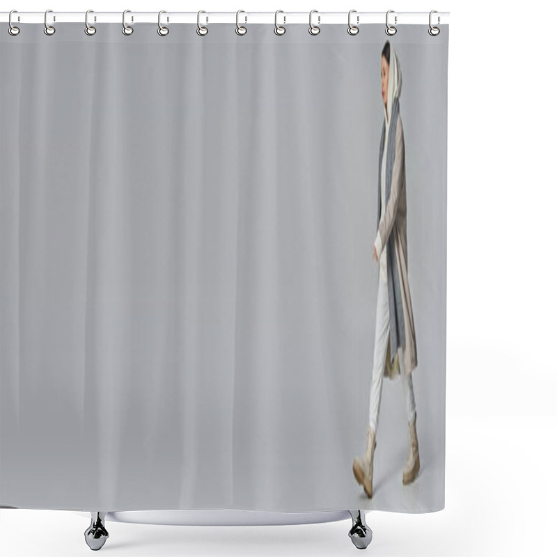 Personality  A Stylish Young Man Is Strolling Elegantly In A Long Trench Coat Against A Grey Backdrop. Shower Curtains