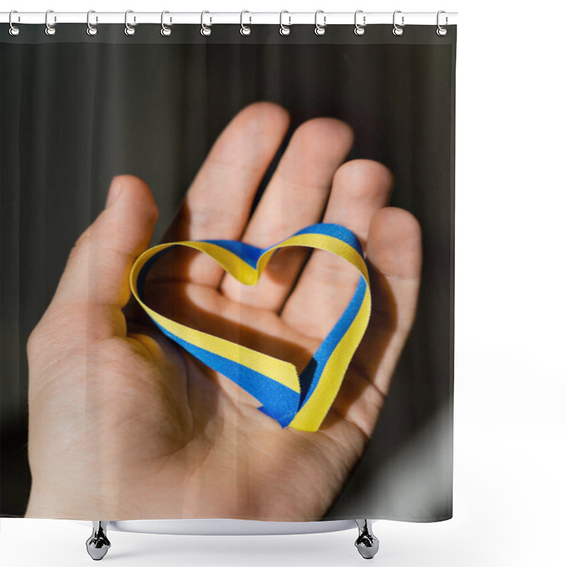 Personality  Cropped View Of Blue And Yellow Ribbon In Heart Shape On Male Hand On Dark Grey Background  Shower Curtains