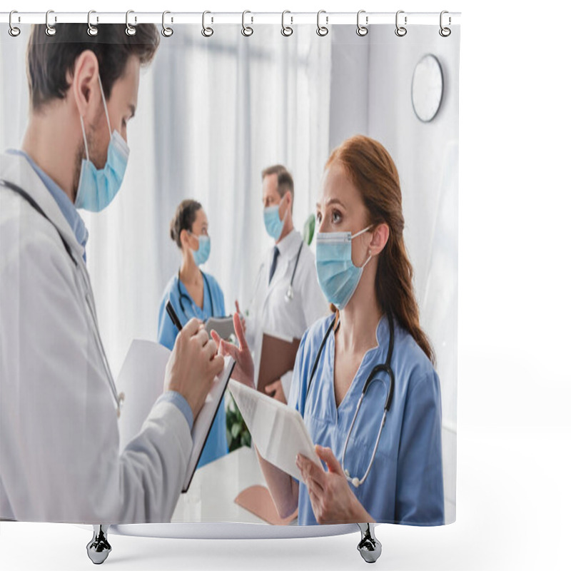 Personality  Redhead Nurse Talking To Doctor Writing In Notebook With Blurred Multicultural Colleagues On Background Shower Curtains