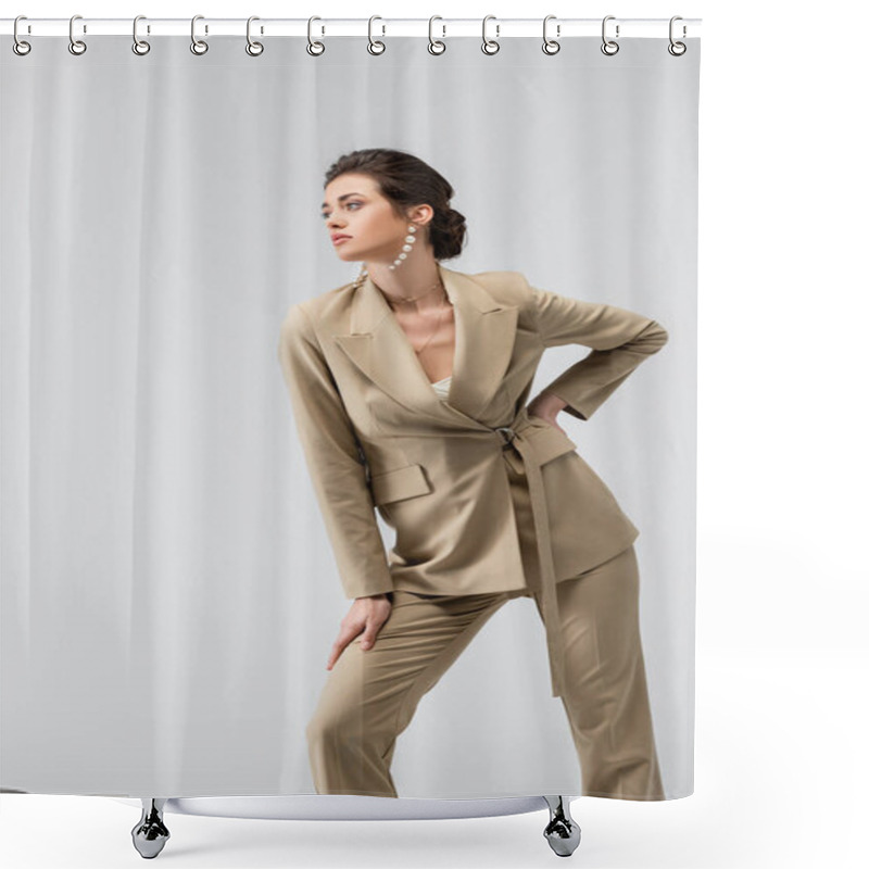 Personality  Elegant Woman In Suit And Pearl Earrings Posing With Hand On Hip Isolated On Grey Shower Curtains