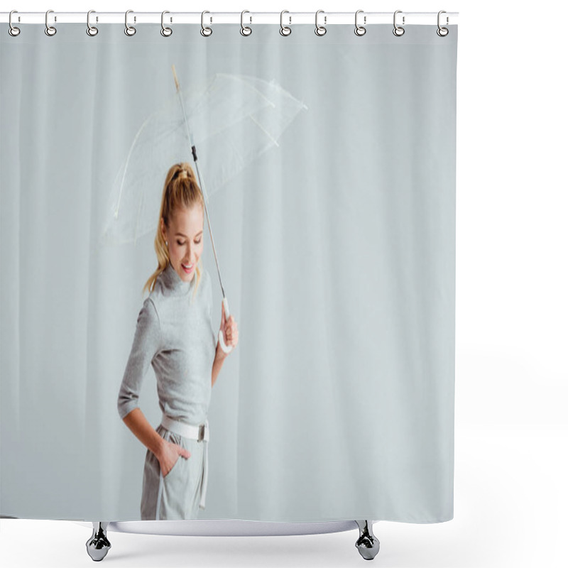 Personality  Smiling Woman In Grey Clothes And Hand In Pocket Posing With Transparent Umbrella Isolated On Grey Shower Curtains